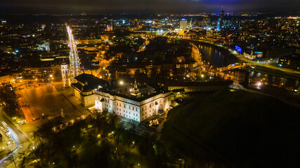 Aerial view of Vilnius old town at night by drone