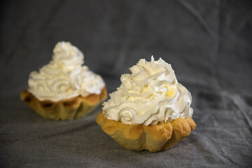 tartlets made of dough with cream and fruit