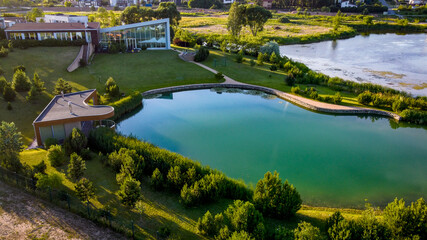 Fototapeta na wymiar Aerial view of luxury house in Vilnius near lake by drone