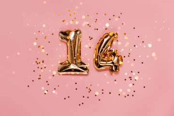 14 foil number saint valentine's day. Numbers with confetti and bokeh lights. Top horizontal view...