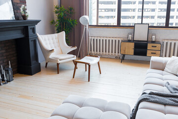 trendy modern design two-level apartment with large high windows. The stylish living room and...