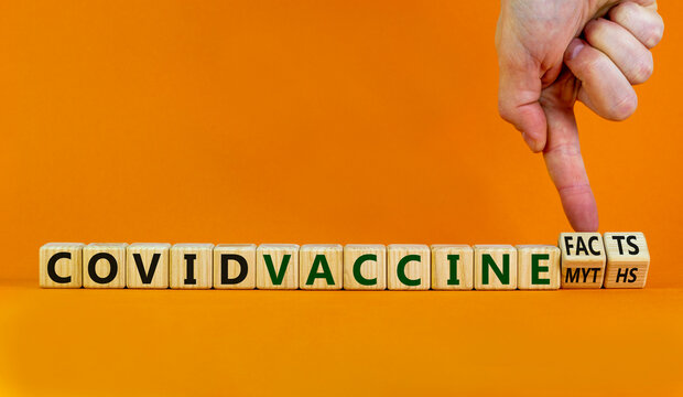 Covid Vaccine Myths Or Facts Symbol. Hand Turns Cubes And Changes Words 'covid Vaccine Myths' To 'covid Vaccine Facts'. Beautiful Orange Background, Copy Space. Covid-19 Vaccine And Medical Concept.