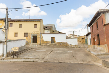 Fototapeta na wymiar a street with typical houses in Poblacion de Campos, province of Palencia, Tierra de Campos, Castile and Leon, Spain