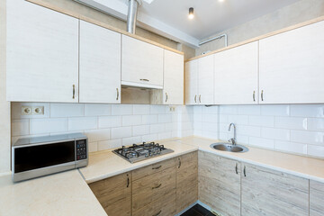 Fototapeta na wymiar interior photo of the apartment, kitchen studio in loft style