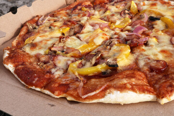Close-up shot of tasty pizza on a paper box