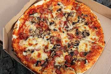 Close-up shot of tasty pizza on a paper box