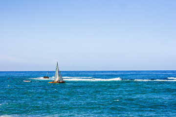 Sailboat at sea  Israel, Tel Aviv. Mediterranean sea landscape over old town of Jaffa in Tel Aviv, Israel.
