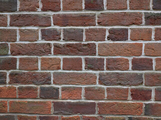 Background of terracotta brickwork in various shades of brown orange