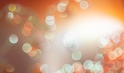 Summer colors, abstract bokeh background. White and yellow blurry circles on orange background.