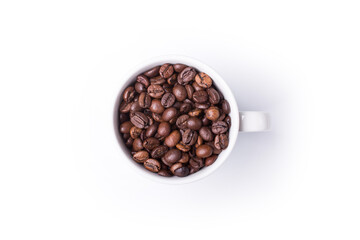 top view of White cup filled with freshly roasted coffee beans