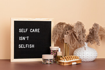 Self care is not selfish. Felt letter board with body and mind care products. Love yourself,...