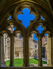 Naklejka premium the ogival arch of the gothic cloister in the La Chaise Dieu abbey in Auvergne, France