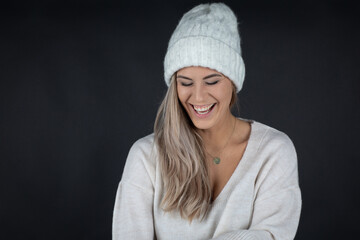 portrait of a woman wearing a hat and smiles