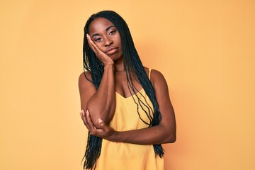 African american woman with braids wearing casual clothes thinking looking tired and bored with depression problems with crossed arms.