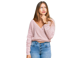 Beautiful blonde woman wearing casual winter pink sweater touching painful neck, sore throat for flu, clod and infection