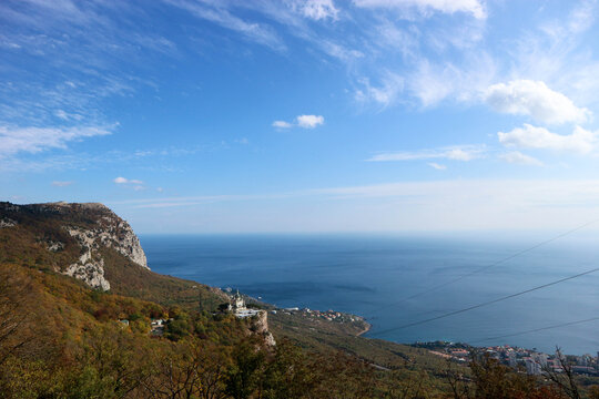 Scenic autumn view from the top of the mountain Baydar gate to the Foros church and coastline of Black sea in Crimea