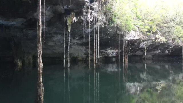 Aerial view of cenotes fresh water natural open caves in Mexican jungle at daylight
