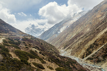 Annapurna III behind clouds seen from Yak Kharka, Annapurna Circuit, Nepal
