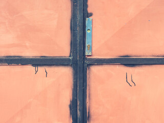 Doorway with stained obsolete paint and interesting locking homemade system