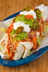 Burritos or tacos. Mexican or Tex-Mex food favorite. Seasoned meat, refried or black beans, Mexican rice, cheese, fried vegetables wrapped in homemade tortillas and served with salsa. Takeout favorite