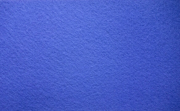 The texture of the carpet is blue with a soft pile