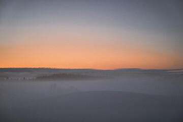 sunrise over the fields of toten, norway, in winter