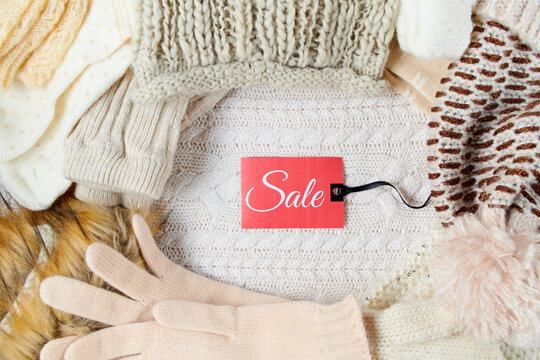 winter flat lay with mittens, hats and winter clothes