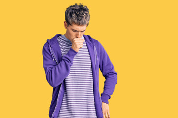 Young handsome man wearing casual purple sweatshirt feeling unwell and coughing as symptom for cold...