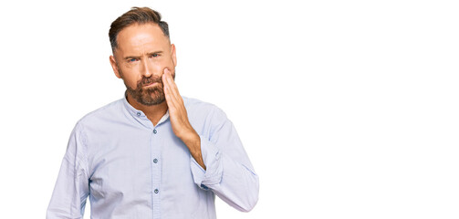 Handsome middle age man wearing business shirt touching mouth with hand with painful expression because of toothache or dental illness on teeth. dentist
