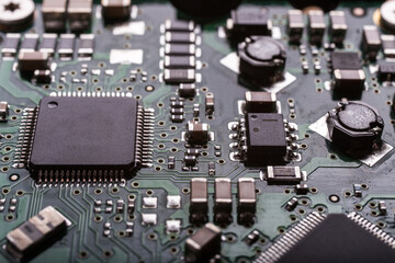Fototapeta premium Computer circuits hardware close up. Motherboard parts, chips, connections, circuit boards visible.