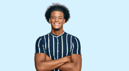 African american man with afro hair wearing casual clothes happy face smiling with crossed arms...