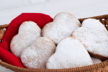Heart-shaped cookies decorated for Valentine's Day.Cookies on a red background.The concept of the Valentine's Day holiday.