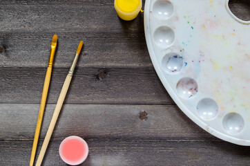 Acrylic paints on the table. Photo of art materials