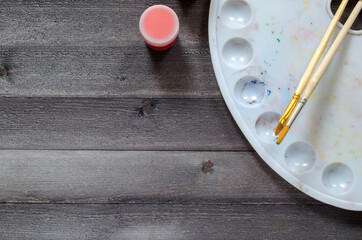 Acrylic paints on the table. Photo of art materials