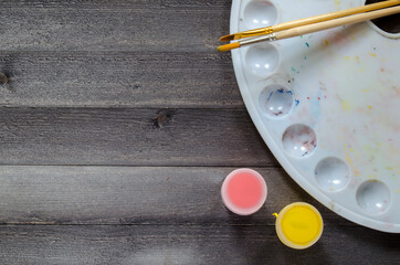 Acrylic paints on the table. Photo of art materials