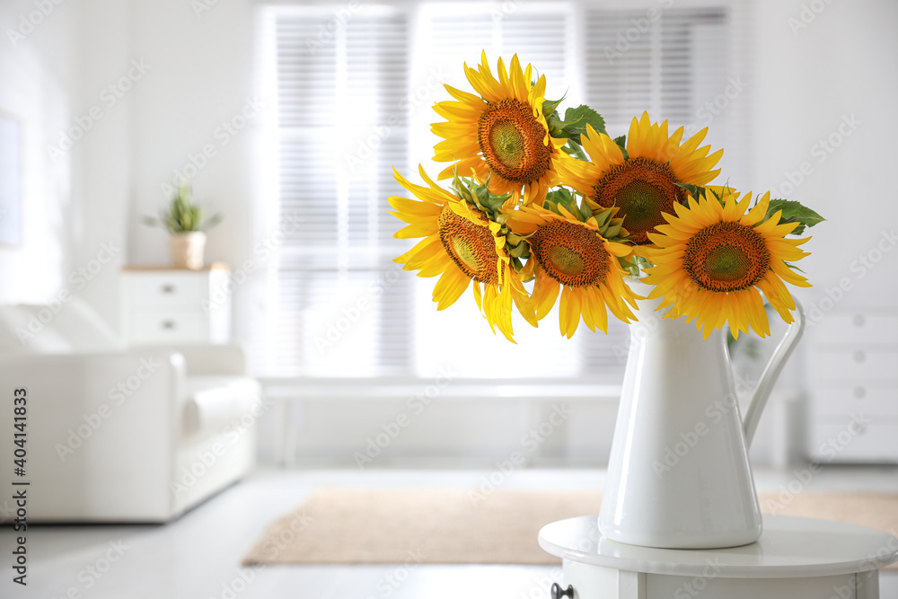 Wall mural Beautiful bouquet of sunflowers in vase on table indoors. Space for text