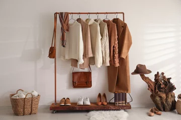 Fotobehang Modern dressing room interior with rack of stylish shoes and women's clothes © New Africa