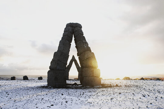 Panorama winter view of monument arches basalt blocks art stone construction Arctic Henge in Raufarhofn North Iceland