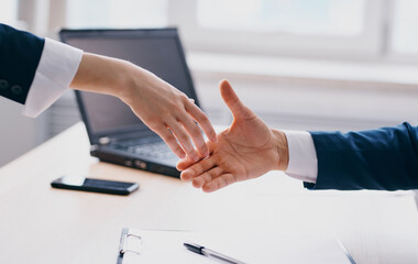 Business people shake hands at work In the office employees are mutual understanding