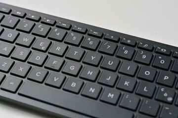 Black qwerty keyboard with low profile keys and Euro symbol.
