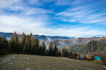 Hills and houses in the fog in the morning in the mountains in the village
