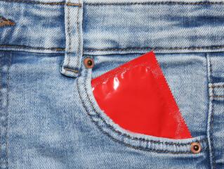 Condoms in package in jeans.