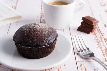 chocolate dessert on a plate with coffee