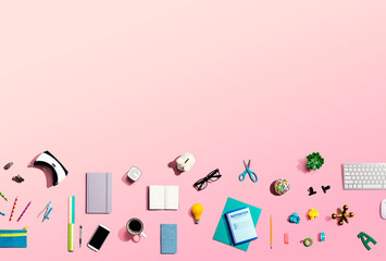 Collection of electronic gadgets and office supplies - flat lay