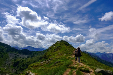 hikers on a path to a summit from a mountain