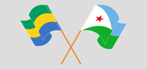 Crossed and waving flags of Gabon and Djibouti