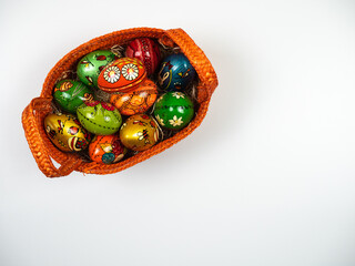 Easter composition. Easter basket with eggs on white background. Flat lay, top view.