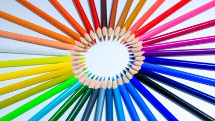 Creative and bright shape in the form of a circle built from colored pencils.