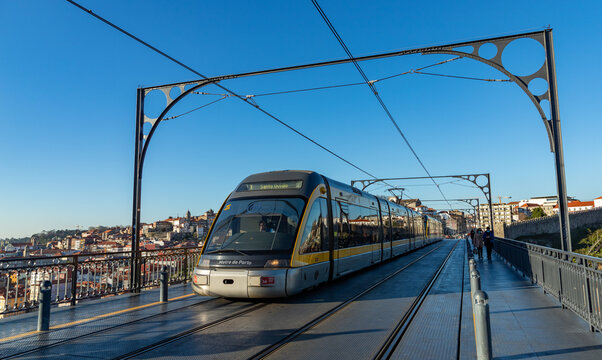 Gaia, Portugal - December 26, 2020: A picture of the Metro do Porto (Porto Subway) riding on top of the Luís I bridge.