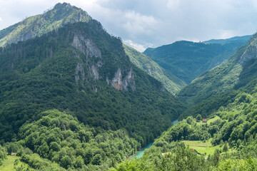 View at a peak and valley in Dormitor meuntains in summer